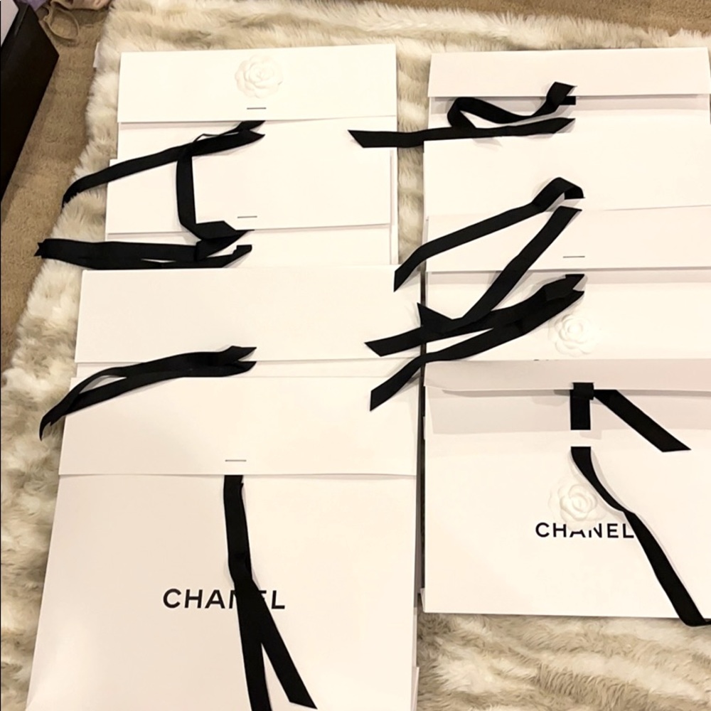 Chanel self tie l bags in various sizes.